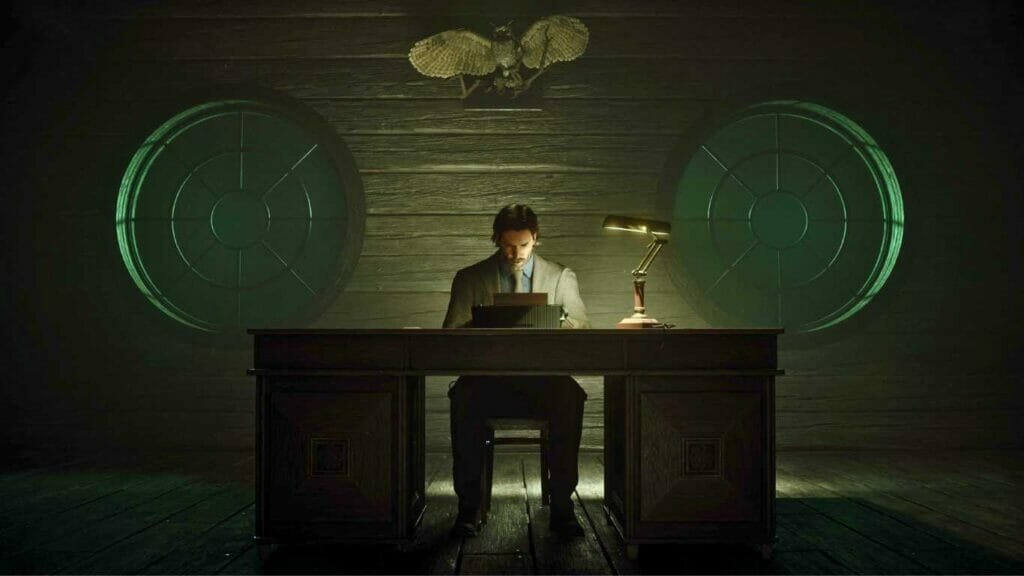 Alan Wake 2 - Man typing on typewriter in dark room